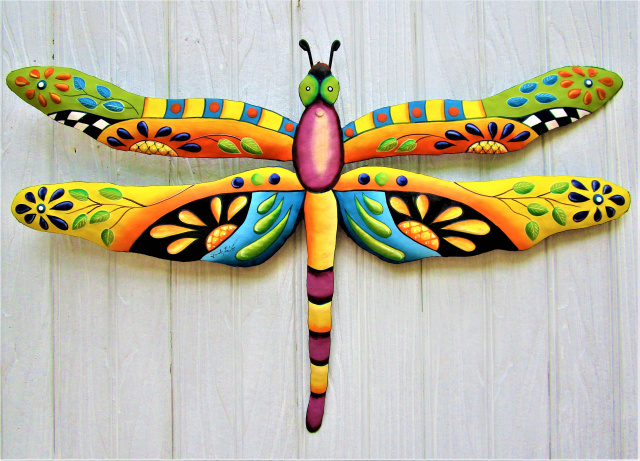 Hand painted metal dragonfly wall hanging.